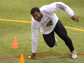 University of Manitoba Bisons defensive tackle David Onyemata runs a drill for NFL scouts in Winnipeg on March 14, 2016. (Brian Donogh/Postmedia Network)