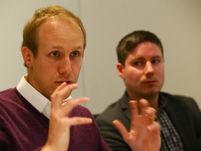 Ian Black, general manager of Uber Canada, left, and Chis Schafer, public policy manager, during an editorial board meeting at the Toronto Sun on Tuesday, April 26, 2016. (Dave Abel/Toronto Sun)