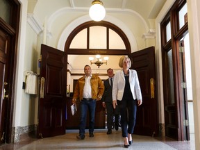 (Left to right) Deputy Grand Chief Isaac Laboucan-Avirom, Premier Rachel Notley and Indigenous Relations Minister Richard Feehan exit the premier's offices after signing a protocol agreement between the Government of Alberta and Treaty 8 First Nations at the Alberta Legislature in Edmonton, Alta., on Tuesday April 26, 2016. (Ian Kucerak photo)