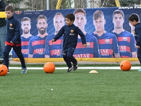 Kids practice at Fuhr Sports Park during a new soccer school  with FC Barcelona staff after the club announced a new soccer academy for the Edmonton area, the third FCBEscola soccer academy in Canada, after Toronto and Vancouver, Tuesday in Spruce Grove. (Ed Kaiser)