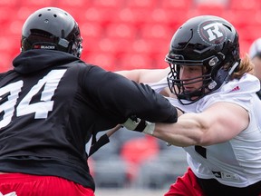 Offensive lineman Jesse Peterson (right) during the final day of the RedBlacks mini-camp at TD Place in Ottawa on Tuesday, April 26, 2016. (Errol McGihon)
