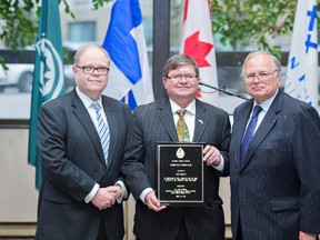 Kevin McCormick, left, president and vice-chancellor of Huntington University, and His Excellency Charles Murto, right, Ambassador of Finland to Canada and CFI Fellow, congratulate Hannu Piironen, Honorary Consul of Finland and CFI Fellow, on his award. Supplied photo