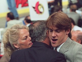 Bryan Berard hugged by his parents Pam and Wally after the Ottawa Senators picked him first overall in the NHL Entry Draft in Edmonton on July 8, 1995. (THE CANADIAN PRESS/Frank Gunn)