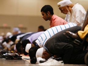 Toronto area Muslims participated in prayers at the Eid al-Fitr Festival at the the Metro Toronto Convention Centre on Friday July 17, 2015. (Jack Boland/Toronto Sun/Postmedia Network)