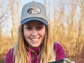 Ashley Rae holds her new personal-best black crappie, which is nearly 14 inches in length. (Supplied photo)