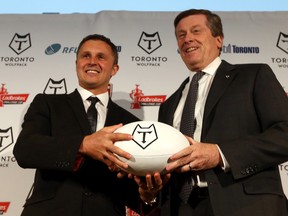 Paul Rowley, head coach of the Wolfpack, with Mayor John Tory after the Rugby Football League announces the addition of the Toronto Wolfpack to the league Wednesday, April 27, 2016. (Dave Abel/Toronto Sun)