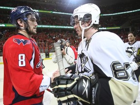 In this March 13, 2009 file photo, Washington Capitals forward Alex Ovechkin shakes hands with Pittsburgh Penguins forward Sidney Crosby following Game 7 of an NHL second-round playoff series in Washington. (AP Photo/Bruce Bennett, Pool, File)