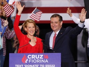 Republican U.S. presidential candidate Ted Cruz waves with Carly Fiorina after he announced Fiorina as his running mate at a campaign rally in Indianapolis, Indiana, United States April 27, 2016.  REUTERS/Aaron P. Bernstein