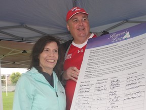 Kathleen Stringer, left, and her husband Gordon were the first to sign a petition in September 2015 calling for Ontario to pass Rowan's Law, a bill aimed at protecting young athletes from concussions. It's named after their late daughter, who died in May 2013 after sustaining several concussions as a high school rugby player. (Postmedia Network file photo)