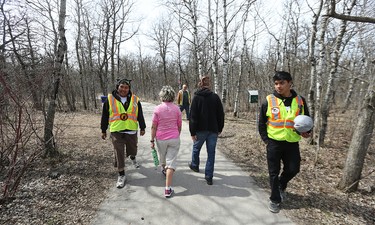 Members of the Bear Clan Patrol conduct a search for Cathy Curtis in the Assiniboine Forest on Wed., April 27, 2016. Curtis, 60, went missing in the St. James area on Monday. Kevin King/Winnipeg Sun/Postmedia Network