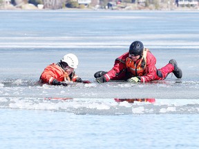 Greater Sudbury Fire Services firefighters were out on Ramsey Lake practising their ice water rescue skills in Sudbury, Ont. on Wednesday April 27, 2016.Gino Donato/Sudbury Star/Postmedia Network