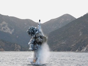 North Korean leader Kim Jong Un guides on the spot the underwater test-fire of strategic submarine ballistic missile in this undated photo released by North Korea's Korean Central News Agency (KCNA) in Pyongyang on April 24, 2016. (KCNA/via REUTERS)