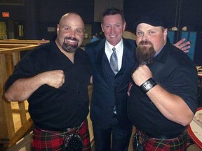 Submitted photo: Bagpipe-playing brothers Robby and Sandy Campbell of the Mudmen pose with hockey legend Wayne Gretzky. The Mudmen, a Celtic-rock band, will be performing in Wallaceburg on May 6.
