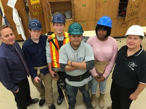 Students from TDSB’s Construction Trades Exploration Program pose at Toronto’s Northview Heights Secondary School. From left are Northview principal Peter Paputsis, Caeden Loane (Northview), William Tennant (Wexford School for the Arts), Renzo Soriano (Northview), Angelicia West (Forest Hill Collegiate) and program head Elvy Moro.