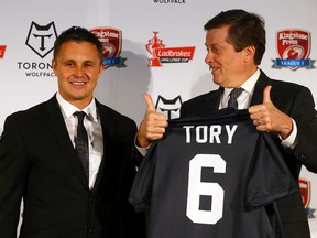 Paul Rowley, head coach of the Toronto Wolfpack, with Mayor John Tory after the Rugby Football League announces the addition of the team at RealSports restaurant in Toronto on April 27, 2016. (Dave Abel/Toronto Sun/Postmedia Network)