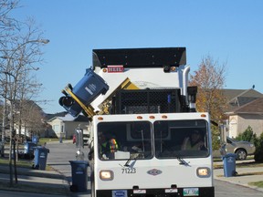 A recycling truck picks up bins in south Winnipeg. (Adam Treusch/Winnipeg Sun file photo)