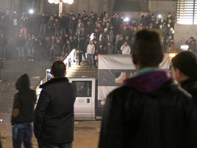 In this Dec. 31, 2015 picture, persons gather at the Cologne, Germany, main station.  (Markus Boehm/dpa via AP)