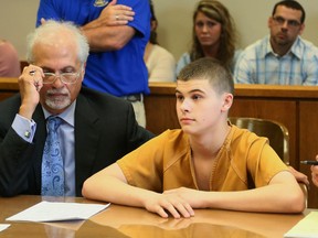 James Austin Hancock, a teen accused of shooting students in a school cafeteria, sits next to his attorney Charlie Rittgers Sr. before Judge Ronald Craft in Butler County Juvenile Court in Hamilton, Ohio, Thursday, April 28, 2016. Hancock pleaded guilty Thursday to four counts of attempted murder and one count of inducing panic. In exchange, Butler County's prosecutor agreed to drop four felonious assault charges against Hancock. (Greg Lynch/The Journal-News via AP)