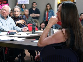 Kingston Frontenac Public Library board members Ralph Gatfield, Jim Neill and chair Claudette Richardson are seen at the library board meeting on Wednesday. (Steph Crosier/The Whig-Standard)