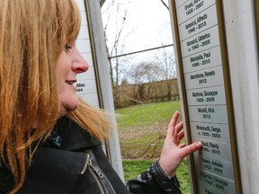 Wendy Seymour found the name of her late husband Randy Muzzi on the new memorial to fallen Italian-Canadian workers. (Dave Thomas/Toronto Sun/Postmedia)