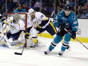 Sharks' Tomas Hertl (right) moves the puck against Predators' Paul Gaustad (28) during NHL action in San Jose, Calif., on Oct. 28, 2015. The Sharks host the Predators in Game 1 in the second round of the NHL playoffs on Friday. (Ben Margot/AP Photo/Files)
