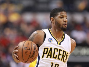 Pacers forward Paul George controls the ball against the Raptors during Game 4 first round NBA playoff action in Indianapolis on April 23, 2016. (Brian Spurlock/USA TODAY Sports)