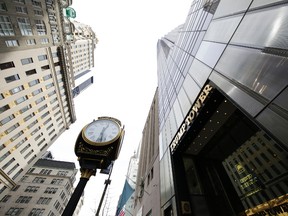 In this March 16, 2016 file photo, Trump Tower, right, the residence of Republican presidential candidate Donald Trump, rises above Fifth Avenue in New York. The Republican front-runnerâ€™s gilded home turf turns into a daily New York town square of political chatter that's a cross-section of the world. (AP Photo/Mark Lennihan)