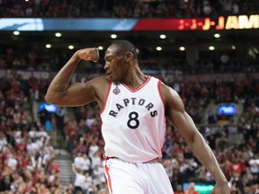 Bismack Biyombo of the Raptors flexes after scoring a basket during his team’s fourth-quarter comeback to win Game 5 of its first-round series against the Indiana Pacers on April 26, 2016. (NICK TURCHIARO/USA Today Sports