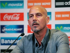 Coach Stephen Hart (inset) was fired after Canada’s 8-1 loss to Honduras in 2012 eliminated it from World Cup contention. (AP)