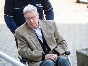 Defendant Reinhold Hanning, a 94-year-old former guard at Auschwitz death camp, is brought to court in a wheelchair before the continuation of his trial in Detmold, Germany, on April 28, 2016. (REUTERS/Bernd Thissen/Pool)