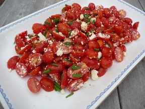 The tomato is the most popular vegetable (or technically fruit) to be grown in Ontario home gardens. Photo shows a tomato salad, made with cherry tomatoes, feta cheese, chives, olive oil and a bit of salt and fresh ground pepper. JOHN DeGROOT/SARNIA OBSERVER/POSTMEDIA NETWORK