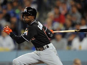 Miami Marlins second baseman Dee Gordon hits against the Los Angeles Dodgers Thursday at Dodger Stadium. (Gary A. Vasquez/USA TODAY Sports)