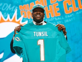 Laremy Tunsil of Mississippi is selected by the Miami Dolphins with the 13th overall pick in the first round of the 2016 NFL draft Thursday at Auditorium Theatre. (Kamil Krzaczynski/USA TODAY Sports)