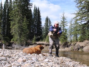 Neil  and Penny on a West Pembina “blue line” trout stream.Neil Waugh