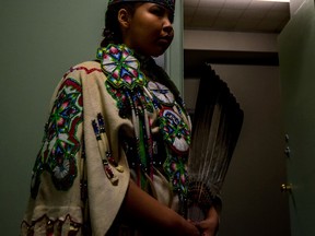 Tatyannah Bull, 16, from Paul Band First Nations waits patiently to perform the Traditional Buckskin dance at the Spiritual Living Stony Plain drum circle at the PERC Building in Stony Plain on Friday, April 22, 2016. Bull has been competing since the age of 13 and has won at more than 60 celebrations - Photo by Yasmin Mayne.