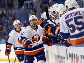 New York Islanders centre Shane Prince is congratulated after scoring a goal against the Tampa Bay Lightning during the first period in Game 1 of the second round in the NHL playoffs at Amalie Arena in Tampa on April 27, 2016. (Kim Klement/USA TODAY Sports)