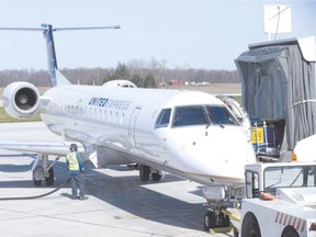 A United Express jet makes a stop at the London International Airport on Wednesday. United?s service to Chicago ends in June ? much to the anger of the chief executive of the London Chamber of Commerce, who blames government fees and rules. (DEREK RUTTAN, The London Free Press)