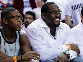 Former NFL player Ray Lewis (right) and his son Ray Lewis III watch Game 2 of the NBA Eastern Conference final between the Miami Heat and the Indiana Pacers in Miami May 24, 2013. (REUTERS file photo)