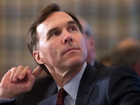 Federal Finance Minister Bill Morneau listens as he's introduced before addressing a Vancouver Board of Trade luncheon in Vancouver, B.C., on Wednesday April 27, 2016. THE CANADIAN PRESS/Darryl Dyck