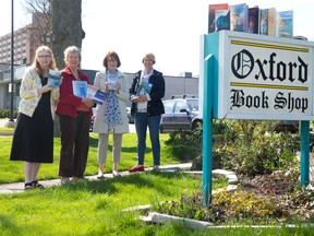 Authors Welwyn Wilton Katz, left, Penn Kemp, Valerie Mills-Milde and Leslie Garrett hold some of their work outside Oxford Book Shop as they gear up for Saturday?s Canadian Authors for Indies Day. (CRAIG GLOVER, The London Free Press)