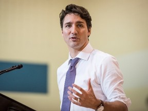 Prime Minister Justin Trudeau speaks with students, teachers, chiefs, and dignitaries at Oskayak High School in Saskatoon, Sask., Wednesday, April 27, 2016. THE CANADIAN PRESS/Matt Smith