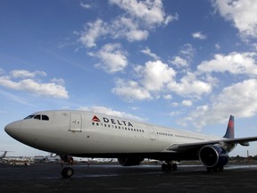 A Delta Airlines Charter arrives at the Ft. Lauderdale-Hollywood International Airport in Ft. Lauderdale, Florida in this January 2, 2013, file photo. (REUTERS/Jeff Haynes/Files)