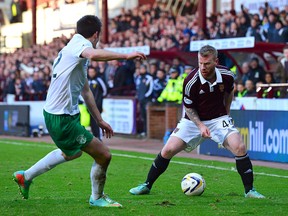 Adam Eckersley, right, playing for Heart of Midlothian F.C. during the Scottish Championship in January 2015 at Tynecastle Stadium in Edinburgh, Scotland. Acquired in an off-season trade by FC Edmonton, a groin injury has kept the native of Manchester, England, on the bench. (Mark Runnacles/Getty Images)