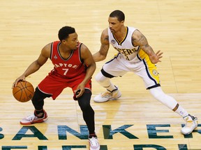 Raptors guard Kyle Lowry (left) dribbles the ball as Pacers guard George Hill (right) defends during the first quarter in Game 6 of the first round NBA playoff series in Indianapolis on Friday, April 29, 2016. (Brian Spurlock/USA TODAY Sports)