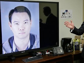 FILE - In this Tuesday, April 26, 2016 file photo, San Francisco Public Defender Jeff Adachi gestures while standing beside a picture of police officer Jason Lai during a news conference in San Francisco. San Francisco’s police chief has ordered “effective immediately” that every sworn officer attend an anti-harassment class while he released more transcripts of a former lieutenant and two former officers exchanging racist text messages. Investigators found the text messages on the personal phones of during criminal probes of former officer Jason Lai and retired Lt. Curtis Liu. (AP Photo/Eric Risberg, File)
