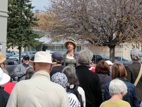Laura Murray, professor of cultural studies and English at Queen's University, leads approximately 100 residents on Bagot Steet as part of the inaugural Jane's Walk in Kingston on Sunday, May 2, 2015. (Steph Crosier/The Whig-Standard)