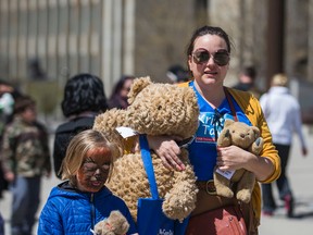 Library user Erin Filby and her son Teddy Filby-Thorn, 8, at theTeddy Bear Picket event at Nathan Phillips Square held by Canadian Union of Public Employees (CUPE Local 4948 – the Toronto Public Library Workers Union) in Toronto, Ont. on Saturday April 30, 2016. Ernest Doroszuk/Toronto Sun/Postmedia Network