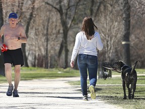 John Klakow, 69, carries his shirt as he jogs on Wellington Crescent in Winnipeg on Sat., April 30, 2016. (Kevin King/Winnipeg Sun/Postmedia Network)