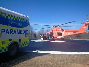 Local paramedics package a female patient in serious condition into a Ornge air ambulance in Ompah after an ATV roll-over in a hydro line corridor north of Arcol Road near Ompah at approximately 12:20 p.m. (Photo courtesy of the Frontenac Paramedic Service)