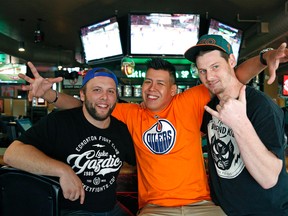 Hockey fans (left to right) Grant Johnson, Ammon Bodie and Bruce Irons discuss the NHL Draft Lottery at the Canadian Brewhouse in Edmonton on April 30, 2016. (Larry Wong photo)